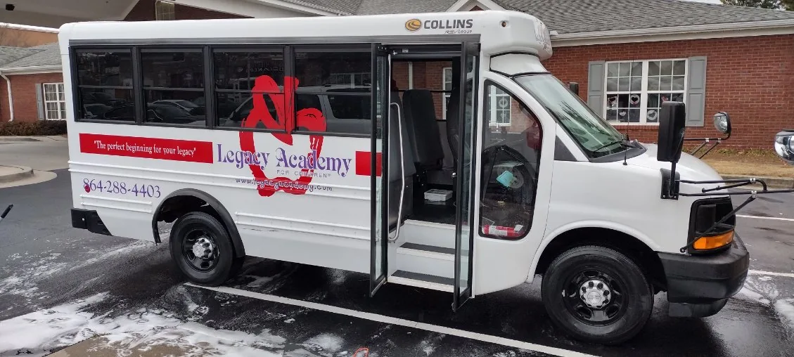 Legacy Academy shuttle bus getting a foam wash from Grindtime Mobile Detailing