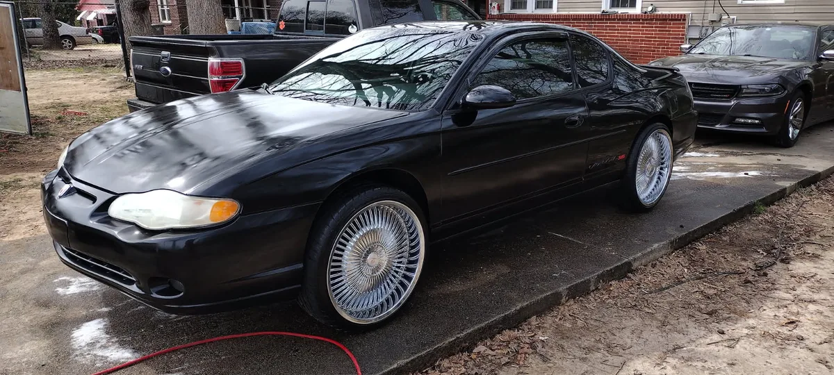 Black Chevy Monte Carlo SS on wire wheels after a Grindtime detail